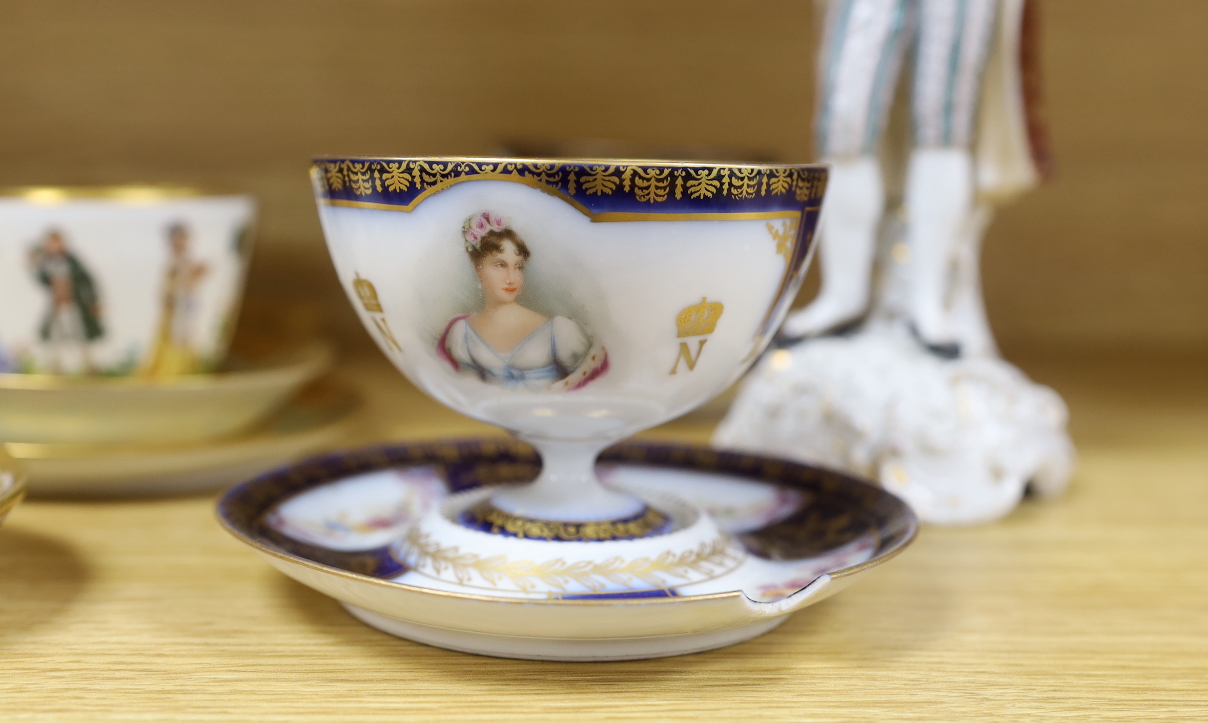 A group of European porcelain tableware to include a pair of figures, Lowestoft jug, Dresden cups etc.